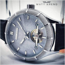 Load image into Gallery viewer, The Luminor Series was conceived with the idea of bold illumination of the digits and hands on a minimalistic watch face. Our first model in this series is featuring a matt grey casing, exquisite black genuine leather strap, bold luminous green digits and hands and a matt grey finish on the dial. We manufacture this watch under the control and supervision of our experienced and skilled watchmakers in our own workshop.