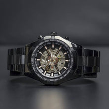 Load image into Gallery viewer, A brand new edition in our Elements series comes with darker features for the modern gentleman. Equipped with black coated stainless steel case and strap and a black metallic face to give this timepiece its solid masculine character. Features include hour, minute, second, date and month indicators and an automatic mechanical chronometer with a 48-hour power reserve.