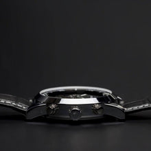 Load image into Gallery viewer, The Nebulae series features a flying Tourbillon on the left side of the face and a multifaceted dial synchronized for pure metallic perfection that leaves a mark with a great statement. Additional features include month, day of week, day/night, 12/24 hour, day of the month, hours, minutes, seconds. The movement of the watch is visible through its transparent back. Masculine, sophisticated and elegant.