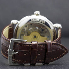 Load image into Gallery viewer, Masterpiece, an enchanting interpretation of time brought to its pure skeleton essence. Aesthetically perfected with inventive and meticulous architecture with a flying Tourbillon, encased with high quality 316L stainless steel casing and powered by a 21 jewel automatic movement with a 60-hour power reserve and a moon phase.