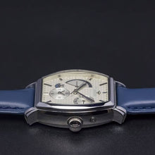 Load image into Gallery viewer, Le Cadre is a venture into fine craftsmanship and an elevation of contemporary design. Exuding an air of fine taste and class with a flawless aesthetic face, the silver coated stainless steel rectangular structure embodies sheer exclusivity. Features include a flying Tourbillon within our signature Matt Arend skeleton calibre, 21 jewel automatic movement with a 60-hour power reserve, day/night, date, hour, minute, second, dual time zone and power reserve of moment indicator functions.