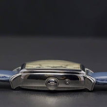 Load image into Gallery viewer, Le Cadre is a venture into fine craftsmanship and an elevation of contemporary design. Exuding an air of fine taste and class with a flawless aesthetic face, the silver coated stainless steel rectangular structure embodies sheer exclusivity. Features include a flying Tourbillon within our signature Matt Arend skeleton calibre, 21 jewel automatic movement with a 60-hour power reserve, day/night, date, hour, minute, second, dual time zone and power reserve of moment indicator functions.