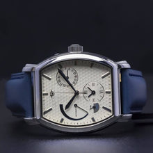 Load image into Gallery viewer, Le Cadre is a venture into fine craftsmanship and an elevation of contemporary design. Exuding an air of fine taste and class with a flawless aesthetic face, the silver coated stainless steel rectangular structure embodies sheer exclusivity. Features include a flying Tourbillon within our signature Matt Arend skeleton calibre, 21 jewel automatic movement with a 60-hour power reserve, day/night, date, hour, minute, second, dual time zone and power reserve of moment indicator functions.