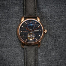 Load image into Gallery viewer, Tour de Noir salutes the traditional craftsmanship with all the ingredients for a true watch collector. Distinctly confident and classic with exclusive features including moon phase, minute, hour, second indicators, open heart caliber with a flying Tourbillon providing a 60-hour power reserve for precision and focus.