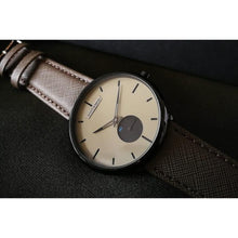 Load image into Gallery viewer, Our new Minimalist Series focused on the Essentials, telling time in an aesthetic way! Clean yet stylish accents on the dial with our brushed stainless steel logo, dual color hands and a high quality genuine leather strap make this new line a clearly superior offer for the affordable investment it represents. The Watch is flawlessly finished, sleek and slim in design and appeals to the very modern Gentleman / -woman.