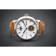 Load image into Gallery viewer, Tour De Bleu salutes traditional craftsmanship and supreme elegance with all the ingredients for a true watch collector in a modern legacy timepiece. Distinctly confident and classic with exclusive features including moon phase, minute, hour, second indicators, open heart calibre providing a 60-hour power reserve for precision and focus it is a true statement piece, blending into the lifestyles of the modern gentleman through its clean and gorgeous light brown suede strap and the well balanced dial layout a