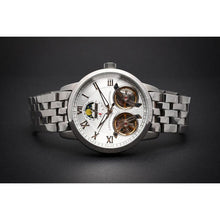 Load image into Gallery viewer, The Heritage timepiece is a grand manifest in the refinement and aesthetics of an automatic wristwatch. With inventive and meticulous architecture of its dual balance wheel, a sleek profile of the hands, timekeeping is optimized to the highest amplitude. Encased with a refined hand hammered dial in full moon silver and a high quality 316L stainless steel casing lie the the two hearts of this exclusive timepiece that is powered by a 45 jewel automatic movement with a 60-hour power reserve. Made for the dedic