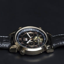 Load image into Gallery viewer, Andaluz is a powerful yet elegant expression of the male fascination with mechanical watch making. Features include day and month calendar, hours, minutes, seconds. The movement of the watch is visible through its transparent back. Extrovert, confident and elegant.