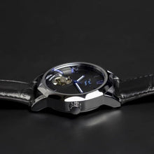 Load image into Gallery viewer, The Blue Mariner series distinguishes itself with an extraordinary hexagon shape of the watch face that adds an extra character to a visually exciting design. Blue Mariner is about striking colors and simplicity with functionality. The movement charges kinetically (by wearing and moving your wrist) or alternatively can be wound on the crown.