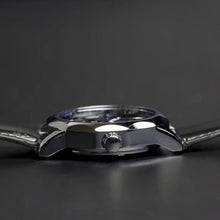 Load image into Gallery viewer, The Blue Mariner series distinguishes itself with an extraordinary hexagon shape of the watch face that adds an extra character to a visually exciting design. Blue Mariner is about striking colors and simplicity with functionality. The movement charges kinetically (by wearing and moving your wrist) or alternatively can be wound on the crown.