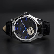 Load image into Gallery viewer, The Blue Mariner series distinguishes itself with an extraordinary hexagon shape of the watch face that adds an extra character to a visually exciting design. Blue Mariner is about striking colors and simplicity with functionality. The movement charges kinetically (by wearing and moving your wrist) or alternatively can be wound on the crown.