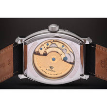 Load image into Gallery viewer, Le Cadre is a venture into fine craftsmanship and an elevation of contemporary design. Exuding an air of fine taste and class with a flawless aesthetic face, the silver coated stainless steel rectangular structure embodies sheer exclusivity. Features include a flying Tourbillon within our signature Matt Arend skeleton calibre, 21 jewel automatic movement with a 60-hour power reserve, day/night, date, hour, minute, second, dual time zone and power reserve of moment indicator functions.