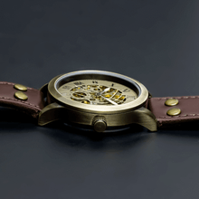 Load image into Gallery viewer, Our Vintage Collection entails a delicate blend of the fine art of mechanical watchmaking with a look and feel that is slightly rugged yet refined. One of the first releases within our Vintage Series features our successful Spherique Model with a burgundy leather strap making up for an irresistible combination of old school vintage looks and modern materials. Simply said, artistically crafted and made complete for Him.
