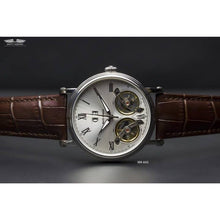 Load image into Gallery viewer, The Heritage timepiece is a grand manifest in the refinement and aesthetics. With inventive and meticulous architecture of its dual balance wheel, a sleek profile of the hands, timekeeping is optimized to the highest amplitude. Encased with a refined silver titanium dial and a high quality 316L stainless steel casing lie the the two hearts of this exclusive timepiece that is powered by a 26 jewel automatic movement with a 60-hour power reserve. Made for the dedicated watch lover with a genuine taste for fin
