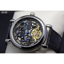 Load image into Gallery viewer, Masterpiece Minuit, an enchanting interpretation of time brought to its pure skeleton essence. Aesthetically perfected with inventive and meticulous architecture with a flying Tourbillon, encased with high quality 316L stainless steel casing and powered by a 21 jewel automatic movement with a 60-hour power reserve and a moon phase.
