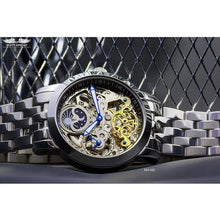 Load image into Gallery viewer, Ajourée, an enchanting interpretation of time brought to its pure skeleton essence. Aesthetically perfected with inventive and meticulous architecture with a flying Tourbillon, encased with high quality 316L stainless steel casing and powered by a 21 jewel automatic movement with a 60-hour power reserve and a moon phase. 
