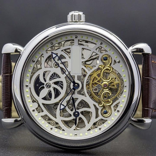 Masterpiece, an enchanting interpretation of time brought to its pure skeleton essence. Aesthetically perfected with inventive and meticulous architecture with a flying Tourbillon, encased with high quality 316L stainless steel casing and powered by a 21 jewel automatic movement with a 60-hour power reserve and a moon phase. 