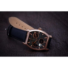 Load image into Gallery viewer, Le Cadre is a venture into fine craftsmanship and an elevation of contemporary design. Exuding an air of fine taste and class with a flawless aesthetic face, the rose-gold coated stainless steel rectangular structure embodies sheer exclusivity. Features include a flying Tourbillon within our signature Matt Arend skeleton calibre, 21 jewel automatic movement with a 60-hour power reserve, day/night, date, hour, minute, second, dual time zone and power reserve of moment indicator functions.
