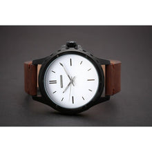 Load image into Gallery viewer, Our first Model of our Townsmen Collection features a charcoal chocolate face in a Matt black casing and a modern clean tan chocolate leather strap.  We wanted to create a selection of contemporary models that reflect the spirit of the young professional, the urbanite who is style conscious and reaching far. 
