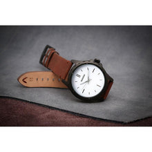 Load image into Gallery viewer, Our first Model of our Townsmen Collection features a charcoal chocolate face in a Matt black casing and a modern clean tan chocolate leather strap.  We wanted to create a selection of contemporary models that reflect the spirit of the young professional, the urbanite who is style conscious and reaching far. 
