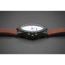 Load image into Gallery viewer, Our first Model of our Townsmen Collection features a charcoal chocolate face in a Matt black casing and a modern clean tan chocolate leather strap.  We wanted to create a selection of contemporary models that reflect the spirit of the young professional, the urbanite who is style conscious and reaching far. 
