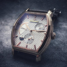 Load image into Gallery viewer, Le Cadre is a venture into fine craftsmanship and an elevation of contemporary design. Exuding an air of fine taste and class with a flawless aesthetic face, the rose-gold coated stainless steel rectangular structure embodies sheer exclusivity. Features within our signature Matt Arend calibre, 21 jewel automatic movement with a 60-hour power reserve, day/night, date, hour, minute, second, dual time zone and power reserve of moment indicator functions.
