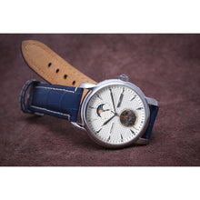 Load image into Gallery viewer, Tour De Blanche salutes the traditional craftsmanship with all the ingredients for a true watch collector. Distinctly confident and classic with exclusive features including moon phase, minute, hour, second indicators, open heart caliber with a flying Tourbillon providing a 60-hour power reserve for precision and focus.
