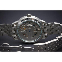 Load image into Gallery viewer, The Heritage timepiece is a grand manifest in the refinement and aesthetics of an automatic wristwatch. With inventive and meticulous architecture of its dual balance wheel, a sleek profile of the hands, timekeeping is optimized to the highest amplitude. Encased with a refined hand hammered dial in full moon silver and a high quality 316L stainless steel casing lie the the two hearts of this exclusive timepiece that is powered by a 45 jewel automatic movement with a 60-hour power reserve. Made for the dedic
