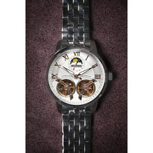 Load image into Gallery viewer, The Heritage timepiece is a grand manifest in the refinement and aesthetics of an automatic wristwatch. With inventive and meticulous architecture of its dual balance wheel, a sleek profile of the hands, timekeeping is optimized to the highest amplitude. Encased with a refined hand hammered dial in full moon silver and a high quality 316L stainless steel casing lie the the two hearts of this exclusive timepiece that is powered by a 45 jewel automatic movement with a 60-hour power reserve. Made for the dedic
