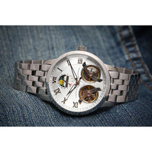 Load image into Gallery viewer, The Heritage timepiece is a grand manifest in the refinement and aesthetics of an automatic wristwatch. With inventive and meticulous architecture of its dual balance wheel, a sleek profile of the hands, timekeeping is optimized to the highest amplitude. Encased with a refined hand hammered dial in full moon silver and a high quality 316L stainless steel casing lie the the two hearts of this exclusive timepiece that is powered by a 45 jewel automatic movement with a 60-hour power reserve. Made for the dedic
