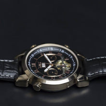 Load image into Gallery viewer, Andaluz is a powerful yet elegant expression of the male fascination with mechanical watch making. Features include day and month calendar, hours, minutes, seconds. The movement of the watch is visible through its transparent back. Extrovert, confident and elegant.
